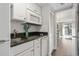 White kitchen with granite countertops and appliances at 210 75Th Ave N # 4011, Myrtle Beach, SC 29572