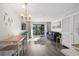 Bright living room with sofa, wood floors, and access to balcony at 210 75Th Ave N # 4011, Myrtle Beach, SC 29572