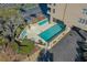 Elevated view of community pool and lounge chairs at 210 75Th Ave N # 4011, Myrtle Beach, SC 29572