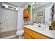 Clean bathroom with shower/tub combo, vanity, and linen cabinet at 2102 Hawksmoor Dr., Conway, SC 29526