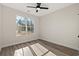 Bedroom with wood-look floors and large window at 216 William Nobles Rd., Aynor, SC 29511