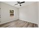 Bright bedroom with wood-look floors and ceiling fan at 216 William Nobles Rd., Aynor, SC 29511
