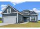 Newly built home with gray siding, white garage door, and landscaping at 216 William Nobles Rd., Aynor, SC 29511