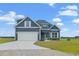 Two-story house with gray siding, white trim, and a two-car garage at 216 William Nobles Rd., Aynor, SC 29511