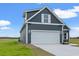 Gray house with white garage door, showcasing the side profile at 216 William Nobles Rd., Aynor, SC 29511