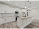 Modern kitchen with white cabinets, granite countertops, and island at 216 William Nobles Rd., Aynor, SC 29511