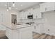 Modern kitchen with white cabinets, granite countertops, and island at 216 William Nobles Rd., Aynor, SC 29511