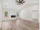 Bright living room with hardwood floors, fireplace, and access to other rooms at 216 William Nobles Rd., Aynor, SC 29511