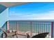 Ocean view from a condo balcony with two chairs at 2201 Ocean Blvd. S # 1809, Myrtle Beach, SC 29577