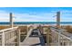 Beach walkway with outdoor showers; steps to the sand at 2201 Ocean Blvd. S # 1809, Myrtle Beach, SC 29577