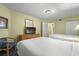 Spacious bedroom with two double beds, a dresser, and a chair at 2201 Ocean Blvd. S # 1809, Myrtle Beach, SC 29577