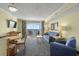 Living room with ocean view, sofa, chairs and dining table at 2201 Ocean Blvd. S # 1809, Myrtle Beach, SC 29577
