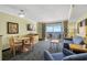 Living room with ocean view, sofa, chairs and dining table at 2201 Ocean Blvd. S # 1809, Myrtle Beach, SC 29577
