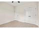 Bedroom with hardwood floors, double doors and an additional door at 224 William Nobles Rd., Aynor, SC 29511