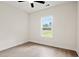 Well-lit bedroom with wood-look floors and a view from the window at 224 William Nobles Rd., Aynor, SC 29511