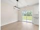 Bright dining area with hardwood floors and sliding glass doors to patio at 224 William Nobles Rd., Aynor, SC 29511
