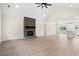 Living room with hardwood floors, a brick fireplace, and high ceilings at 224 William Nobles Rd., Aynor, SC 29511