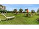 Lush courtyard with tables, chairs and lounge chairs at 2310 North Ocean Blvd. # 605, Myrtle Beach, SC 29577