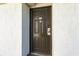 Dark brown condo entry door with keyless entry and no smoking sign at 2310 North Ocean Blvd. # 605, Myrtle Beach, SC 29577