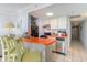 Small kitchen with orange countertops, black appliances, and breakfast bar at 2310 North Ocean Blvd. # 605, Myrtle Beach, SC 29577
