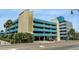 Multi-level parking garage with teal and beige exterior at 2310 North Ocean Blvd. # 605, Myrtle Beach, SC 29577