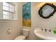 Charming bathroom with beach mural and updated vanity at 234 Sugar Mill Loop, Myrtle Beach, SC 29588