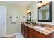 Bathroom with double sink vanity featuring granite countertops and dark wood cabinets at 234 Sugar Mill Loop, Myrtle Beach, SC 29588