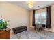 Cozy room with a desk and ottoman that features a charming chandelier and bright window at 234 Sugar Mill Loop, Myrtle Beach, SC 29588
