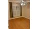 Bedroom with tan walls, window with curtains, and ceiling fan with light fixture at 234 Sugar Mill Loop, Myrtle Beach, SC 29588
