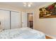 Well-lit bedroom with a closet and comfortable bed with a patterned bedspread at 234 Sugar Mill Loop, Myrtle Beach, SC 29588