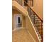View of the foyer area with open staircase, attractive flooring and view to front door at 234 Sugar Mill Loop, Myrtle Beach, SC 29588
