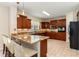 Spacious kitchen featuring granite countertops, wooden cabinets, and modern appliances at 234 Sugar Mill Loop, Myrtle Beach, SC 29588