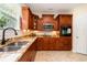 Well-lit kitchen featuring granite countertops, wooden cabinetry, and stainless appliances at 234 Sugar Mill Loop, Myrtle Beach, SC 29588