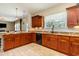 Well-lit kitchen featuring granite countertops, wooden cabinetry, and a modern design at 234 Sugar Mill Loop, Myrtle Beach, SC 29588