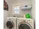 Well-equipped laundry room featuring a side-by-side washer and dryer, plus a storage rack at 234 Sugar Mill Loop, Myrtle Beach, SC 29588