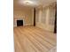 Open living room featuring a fireplace and large windows with elegant draperies at 234 Sugar Mill Loop, Myrtle Beach, SC 29588