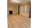 Bright living room featuring hardwood floors, fireplace, and large windows at 234 Sugar Mill Loop, Myrtle Beach, SC 29588