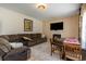 Comfortable living area with a large sofa, dining table, fireplace, and television at 234 Sugar Mill Loop, Myrtle Beach, SC 29588