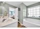 Bathroom with double vanity, shower, and bathtub at 281 Sugar Mill Loop, Myrtle Beach, SC 29579