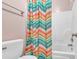 Simple bathroom with a colorful shower curtain and tub at 281 Sugar Mill Loop, Myrtle Beach, SC 29588