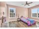 Bright bedroom with light pink walls and a comfortable bed at 281 Sugar Mill Loop, Myrtle Beach, SC 29588