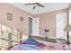 Charming bedroom with light pink walls and plenty of light at 281 Sugar Mill Loop, Myrtle Beach, SC 29588