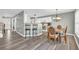Kitchen and dining area with wood flooring and a spacious dining table at 281 Sugar Mill Loop, Myrtle Beach, SC 29588