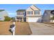 Two-story house with attached garage and landscaping at 281 Sugar Mill Loop, Myrtle Beach, SC 29588