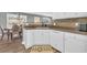 White kitchen cabinets, brown countertops, and modern appliances at 281 Sugar Mill Loop, Myrtle Beach, SC 29588