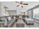 Living room with large sectional sofa and ceiling fan at 281 Sugar Mill Loop, Myrtle Beach, SC 29579