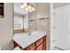 This bathroom features a large mirror, a sink, and a window for natural light at 290 Georgia Mae Loop, Conway, SC 29527