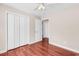 Comfortable bedroom with hardwood floors, a ceiling fan, and closet space at 290 Georgia Mae Loop, Conway, SC 29527
