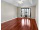 This bedroom features natural light, a ceiling fan, tray ceiling, and wood-look floors at 290 Georgia Mae Loop, Conway, SC 29527