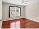 This bedroom features natural light, a ceiling fan, and beautiful wood-look floors at 290 Georgia Mae Loop, Conway, SC 29527